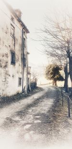 Abandoned building against sky during winter