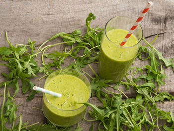 Close-up of fresh drink on green table