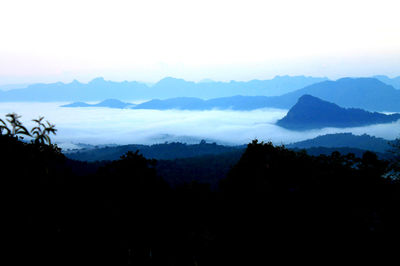 Scenic view of silhouette mountains against sky