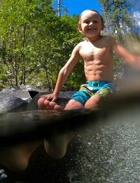 Portrait of smiling boy in pond