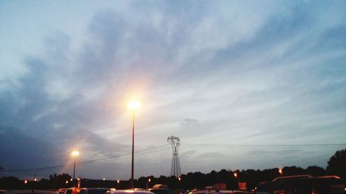 Low angle view of silhouette trees against sky