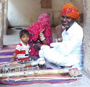 Family sitting with musical instruments