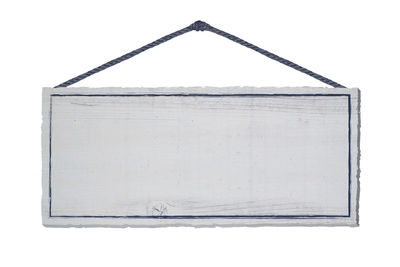 Low angle view of old wooden structure against white background