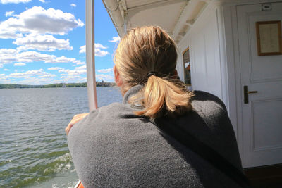 Rear view of woman siting in boat