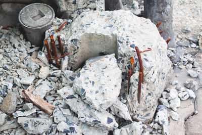 High angle view of garbage on rock