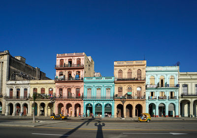 Low angle view of historical building against clear blue sky