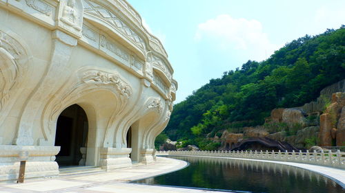 View of historical building against swimming pool