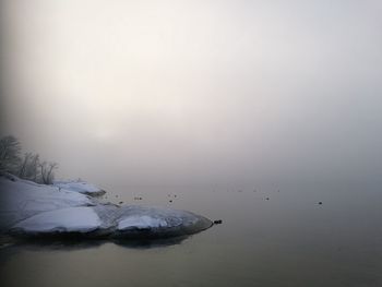 Scenic view of sea against sky during winter