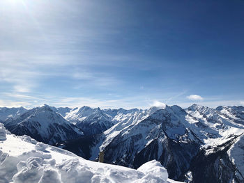 Scenic view of snowcapped mountains against sky