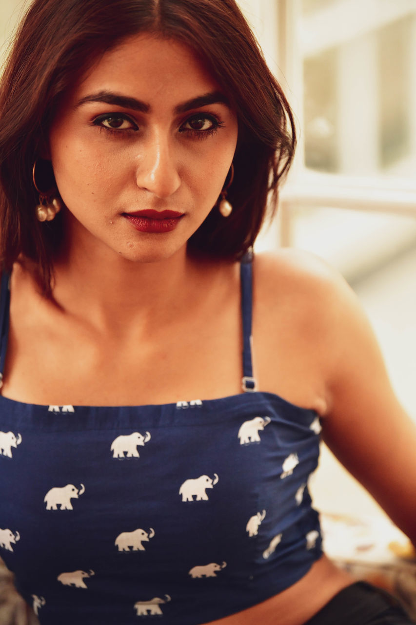 women, one person, adult, portrait, looking at camera, hairstyle, young adult, brown hair, clothing, human hair, photo shoot, indoors, dress, female, front view, emotion, person, fashion, portrait photography, black hair, lifestyles, long hair, waist up, skin, standing, undergarment, focus on foreground, looking, brown eyes, headshot