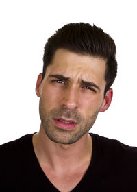 Close-up portrait of young man against white background