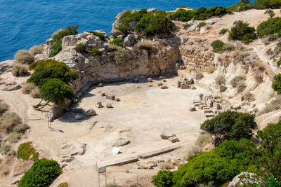 High angle view of rock formations at seaside