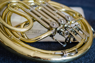 Close-up of trumpet on musical note