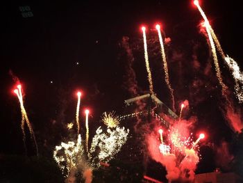 Firework display at night