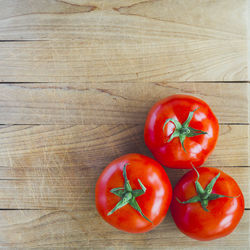 High angle view of tomatoes on cutting board
