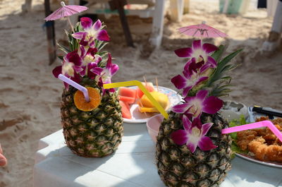 Close-up of pink flowering plants on table