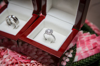 High angle view of wedding rings in box