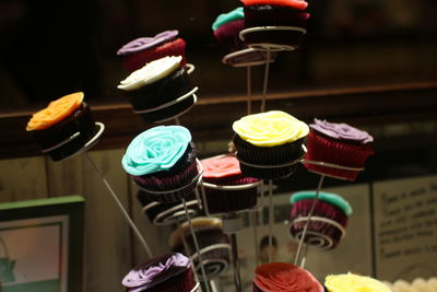 Close-up of cupcakes on display for sale