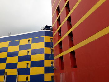 Multi colored building against sky