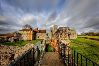 View of old ruin building against cloudy sky