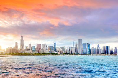 Modern buildings in city at sunset