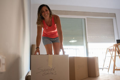 Portrait of smiling young woman at home