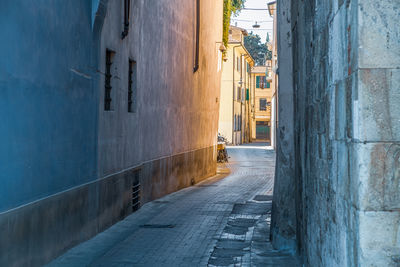 Footpath amidst buildings