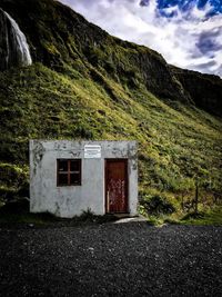 House on field against sky