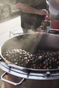 Close-up of man preparing food