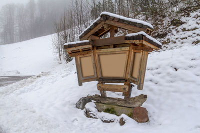 Built structure on snow covered field