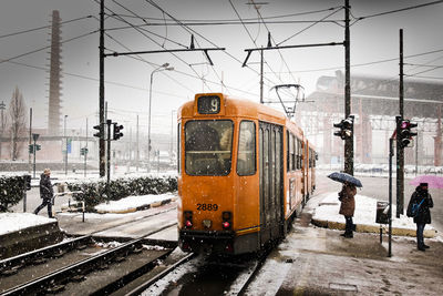 Train on railroad station platform during winter