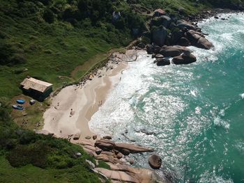 High angle view of rocks by sea