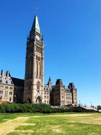 Low angle view of buildings against blue sky