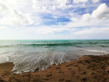 Scenic view of beach against sky