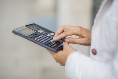 Businesswoman using calculator for accuracy