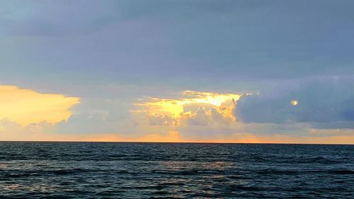 Scenic view of sea against sky at sunset