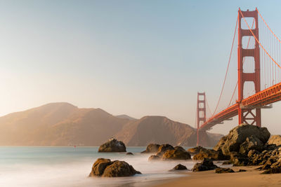 View of suspension bridge over sea