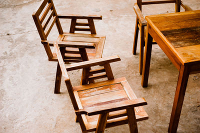 High angle view of empty chairs and table in cafe