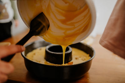 Cropped hand of person preparing food