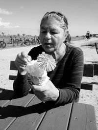 Portrait of woman eating icecream