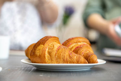 Cropped hand of person having food on table