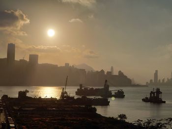 Scenic view of bay against sky during sunset