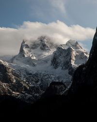 Scenic view of snowcapped mountains against sky