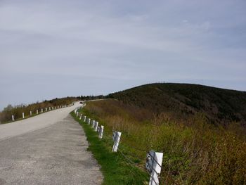 Road amidst landscape against sky