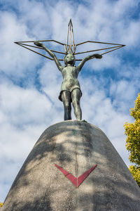 Low angle view of statue against sky