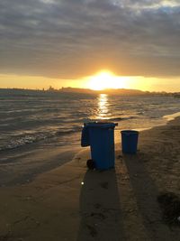 Scenic view of beach against sky during sunset