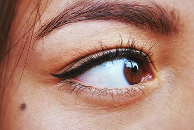 Close-up of woman eye looking away