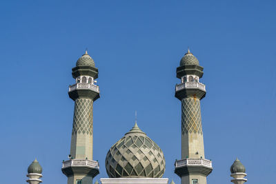 Low angle view of building against clear blue sky