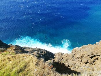 High angle view of sea against blue sky