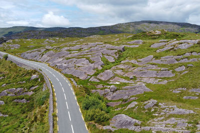 High angle view of road amidst mountains against sky